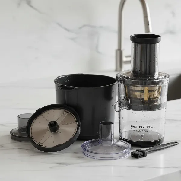 Mueller Austria Juicer disassembled for easy cleaning on a kitchen counter